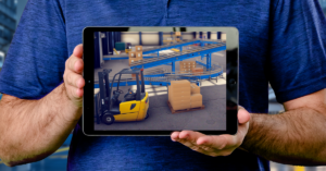 a man holding a tablet with a picture of a forklift